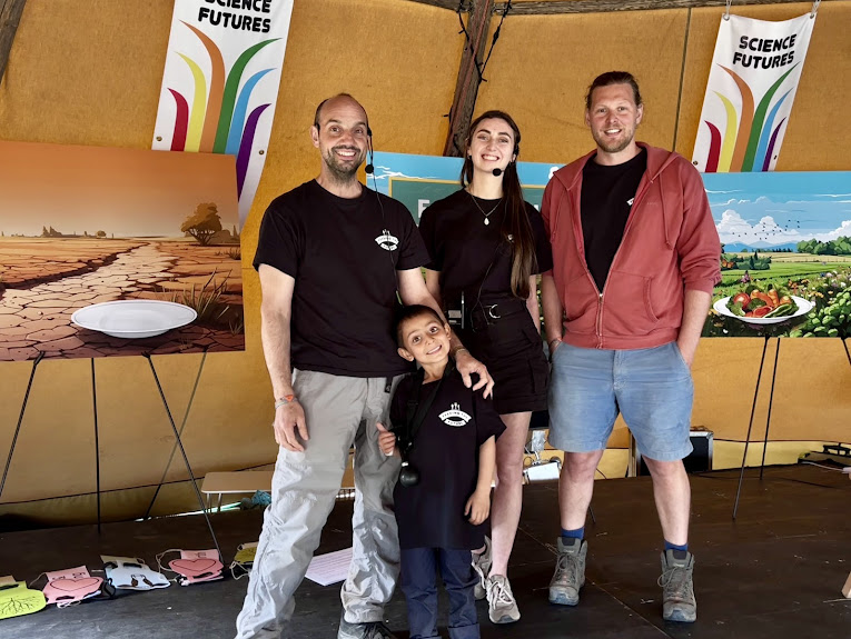 Four people on stage for the Foodopoly stage show in the Science Futures area of Glastonbury Festival.